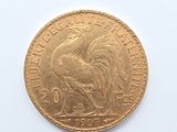 an image of a gold coin with a rooster on it