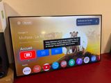 a flat screen tv sitting on a red table