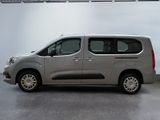 the silver van is parked in the garage of the building