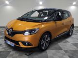 a yellow car is parked in a room with a checkered floor