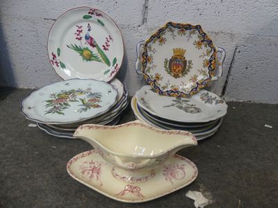 many plates and saucers sitting on the ground