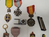 a lot of medals that are on display on a table