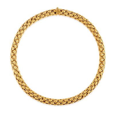 a gold necklace with a chain on a white background
