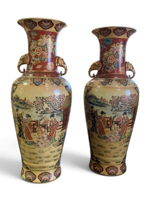 pair of oriental vases on a white background with a white background
