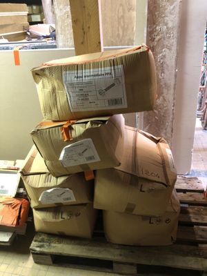 a stack of boxes on a pallet in a warehouse