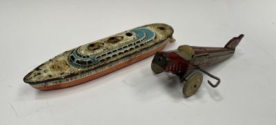 a small toy airplane next to a small toy boat