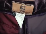 the jacket is purple and black with a brown label on it