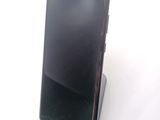 a cell phone that is sitting on top of a stand