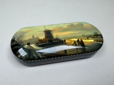 a tin with a picture of a windmill on it