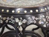 a black table with a floral design on it