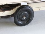 a close up of a toy truck on a white surface