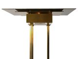 an image of a table with a glass top and gold legs