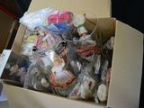 a cardboard box filled with many different types of toys