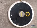 a robot that is sitting on the ground with two buttons