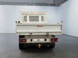 a white truck that is parked in a room