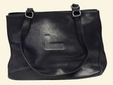 black leather tote bag with a cross on the front