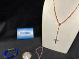 an assortment of jewelry including a necklace, bracelet, and ring