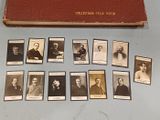 a lot of old photos of men on the table