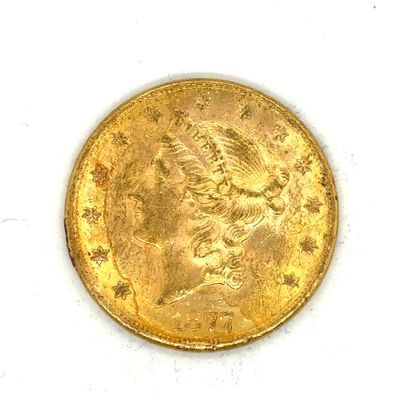 une image d'une pièce d'or sur une surface blanche