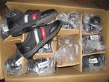 many pairs of shoes in a box on the floor