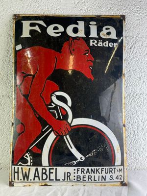 an image of a red and black sign on a white wall