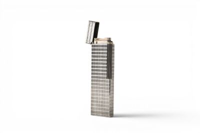 a close up of a tall metal object on a white surface