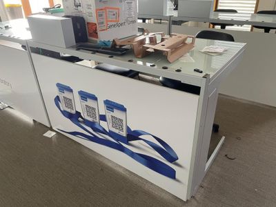 an image of a desk with a lot of items on it