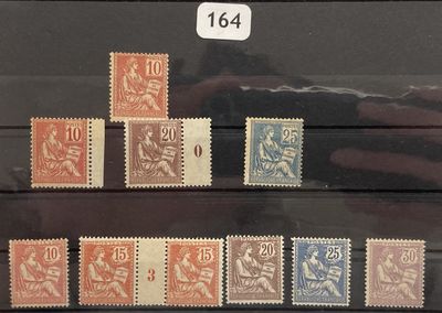 several different stamps on display in a glass case with a number of them