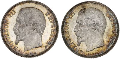 two silver sovereigns, one of which has a profile of a man and the other of which is a