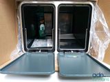 two trays that are sitting inside of a box