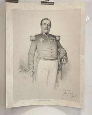 an old picture of a man in military clothing holding a rifle