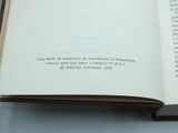 a book open on a table with a pen in it