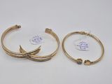 two pairs of gold hoop earrings