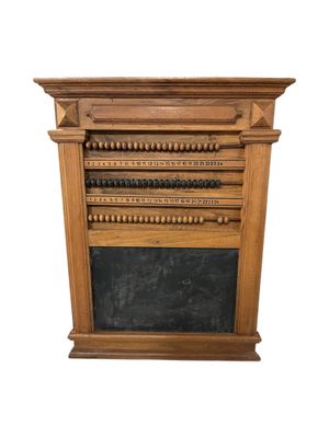 an image of a fireplace with a chalk board on top of it
