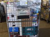 a cart with a lot of items on it in a warehouse