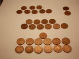 a lot of coins that are on the table