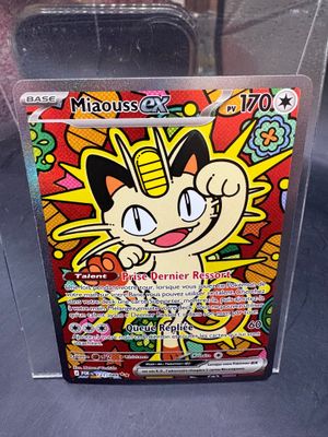 a box of pokemon trading cards with a cartoon character on it