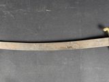 an image of a very old looking knife on a table