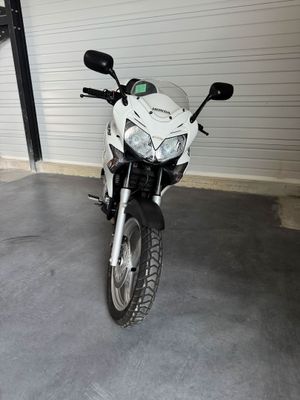 a motorcycle that is parked in a garage