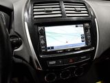 the dashboard of a car with a gps device in it