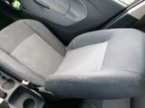 the interior of a car with the seat up and the center console down
