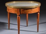 a small table with a marble top and wooden legs