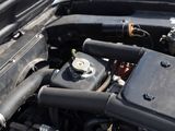 a close up of a car ' s engine with its hood open