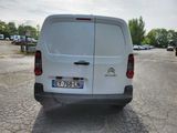 a white van that is parked in a parking lot