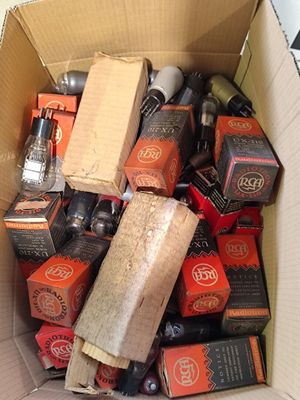 a cardboard box filled with various types of beer