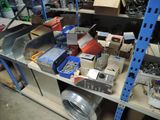 a lot of tools on a shelf in a garage