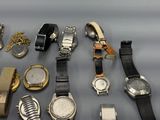 a lot of watches that are sitting on a table