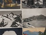 many pictures of a mountain and a lake on the wall