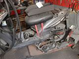 a motor scooter that is parked in a garage
