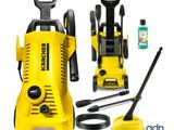 a yellow pressurer with a hose and other cleaning supplies